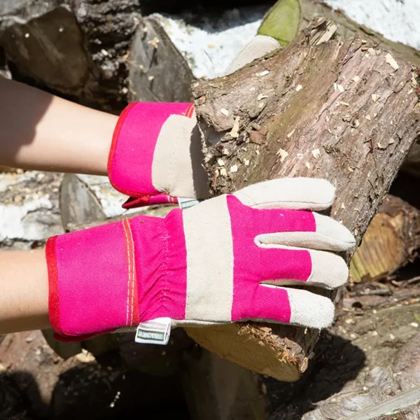 Town & Country All Round Rigger Gloves pink holding a log
