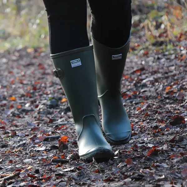 Town & Country Burford Wellington Boots green walking through leaves