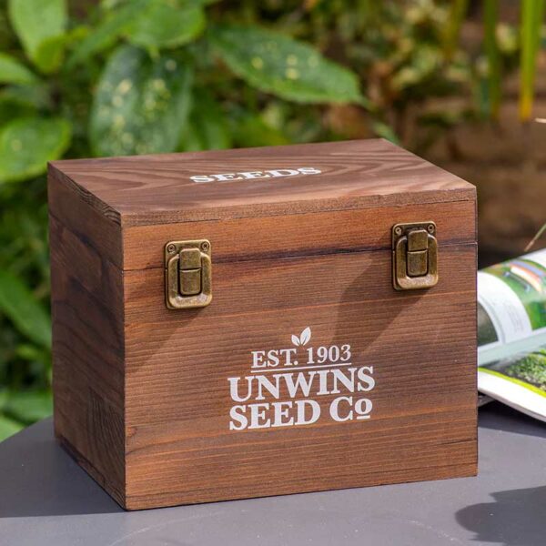 A closed Unwins Gardeners' Seed Box made from wood with white Unwins writing and metal clasps.