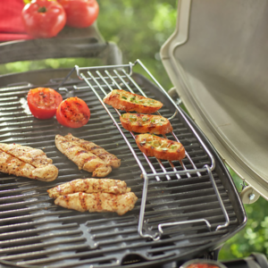 Use the Weber Barbecue Warming Rack for Q 2000 Series to keep food warm