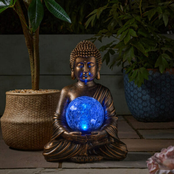 Smart Garden Gazing Buddha globe nighttime blue glow lifestyle image