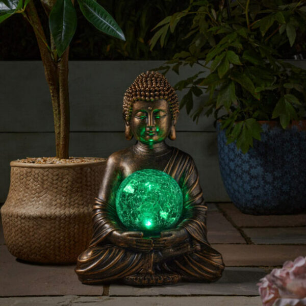 Smart Garden Gazing Buddha globe nighttime green glow lifestyle image