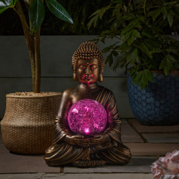Smart Garden Gazing Buddha globe nighttime pink glow lifestyle image