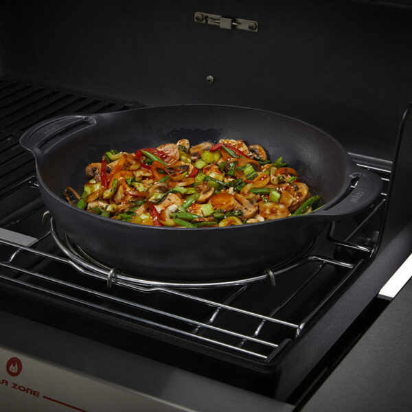 Weber Crafted Wok Set with Steaming Rack in use on gas barbecue with stir fry