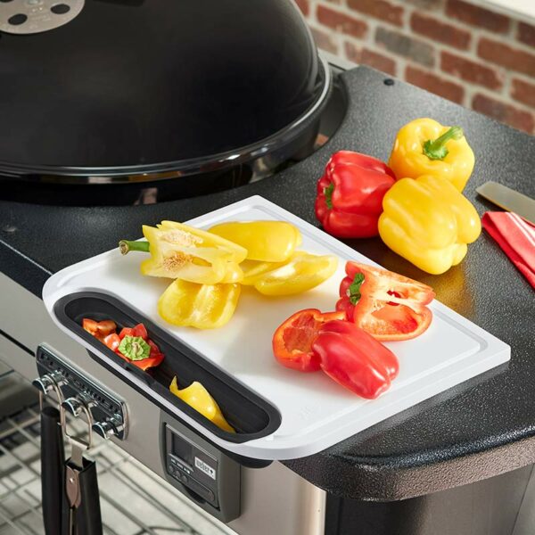 Weber Cutting Board with Catch Bin in use with Performer BBQ