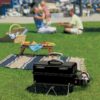 The Weber Go-Anywhere Portable Gas Barbecue in use at the park