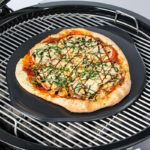 pizza cooking on the Weber Premium Ceramic Glazed Grilling Stone