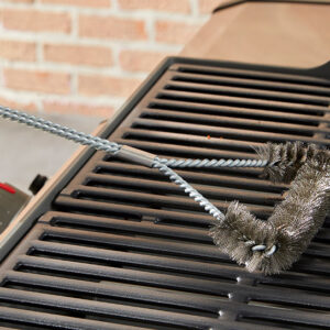 Weber Three-Sided Barbecue Brush in use